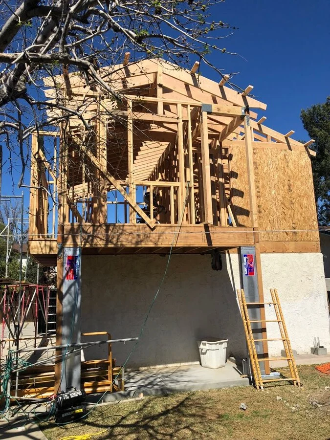 Hillside ADU &mdash; A detached unit framed above grade on a sloped lot.