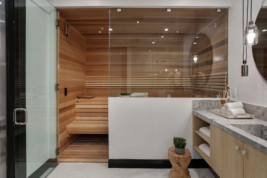 Built-In Sauna &mdash; Cedar paneling and a full glass wall.
