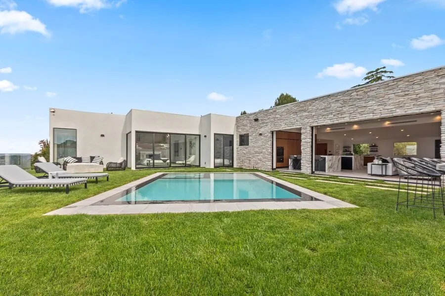 Skyline pool and lawn with mountain views