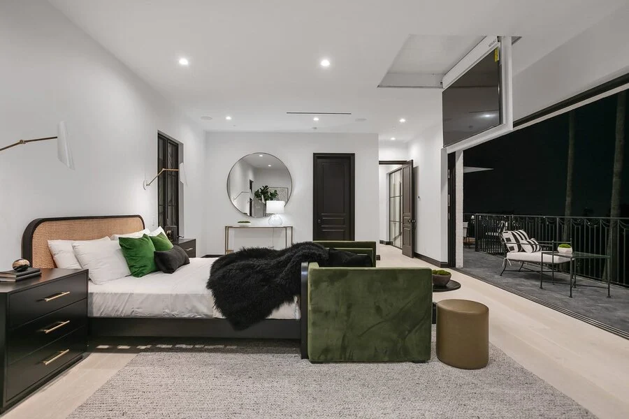 Primary Bedroom &mdash; Olive velvet accents against a warm, layered palette.