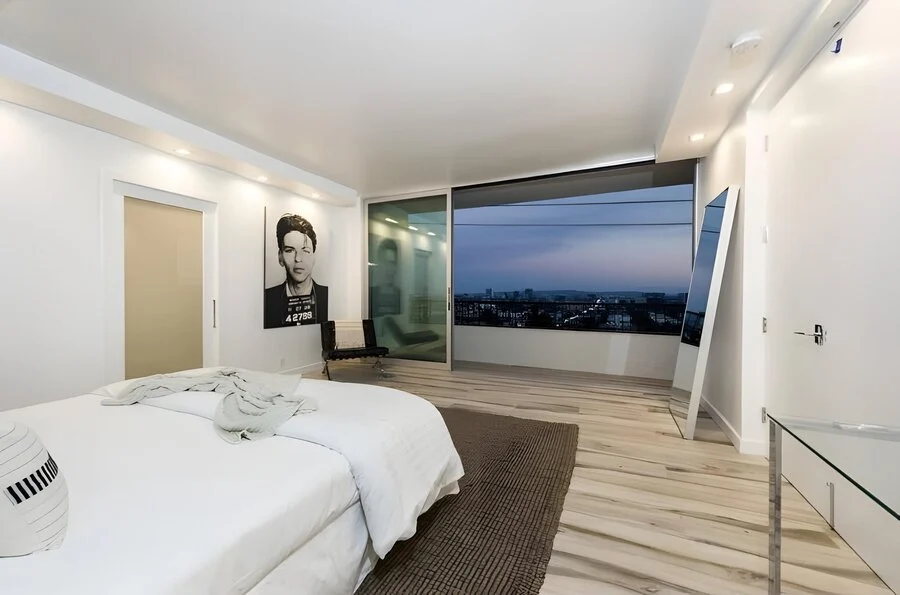Bedroom, Gallery Wall &mdash; A framed print anchors the room at dusk.