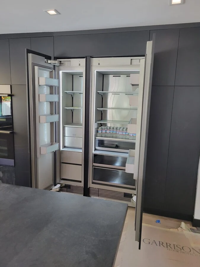 Integrated Pantry &mdash; A paneled cold-storage wall, flush with the cabinetry.