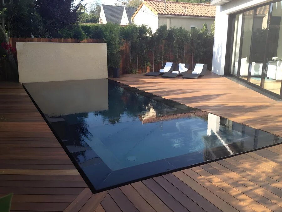 Sunken Glass Pool &mdash; A glass-tile pool set into a wood deck.