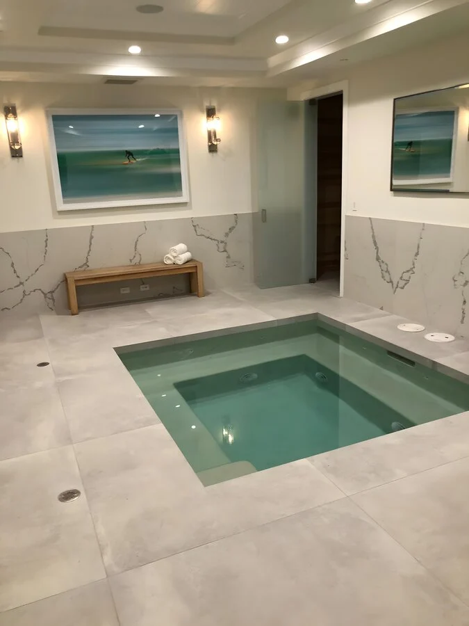 Sunken Spa &mdash; An indoor spa set flush into a stone floor.