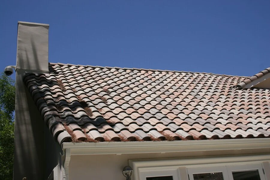 Terracotta Tile &mdash; Classic barrel tile, detailed at the chimney.