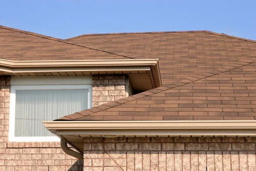 Composition Shingle &mdash; A dormer window set into a shingle roof.