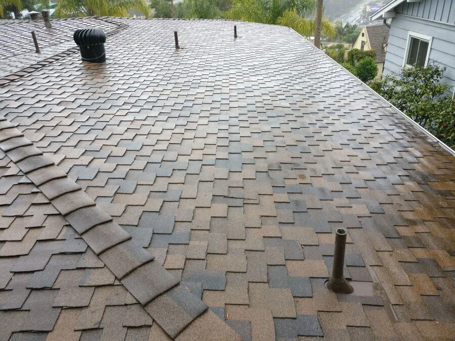Wide Shingle Roof &mdash; A full composition roof against the hills.