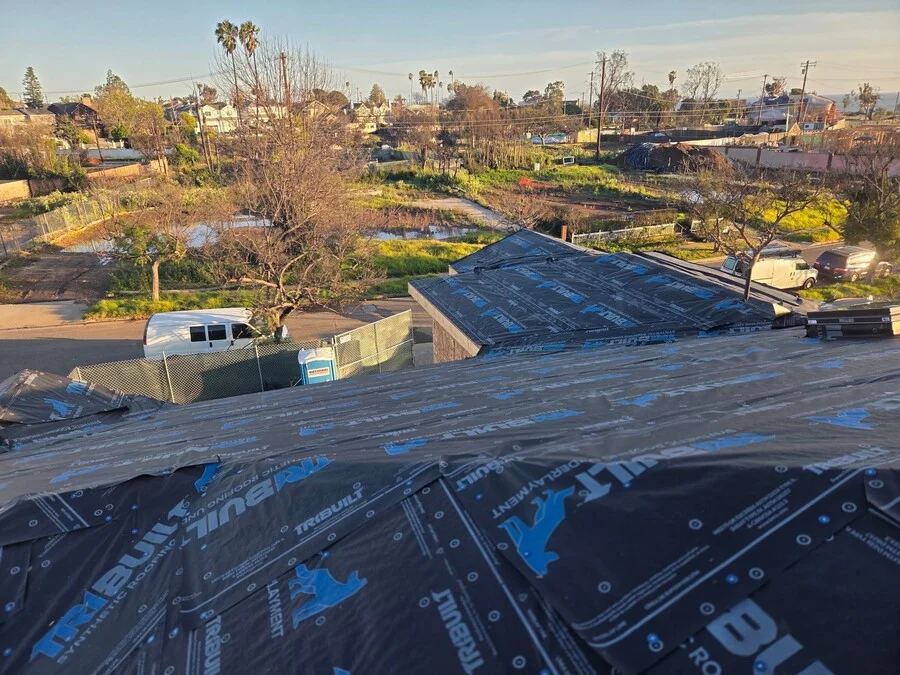 Synthetic Underlayment &mdash; A fresh underlayment laid ahead of the final roofing material.