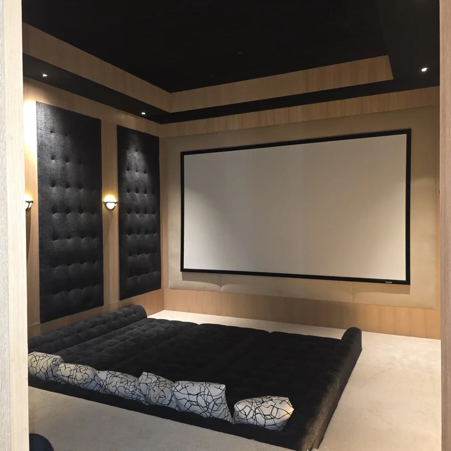 The Home Theater &mdash; Tufted leather walls and an oversized daybed.