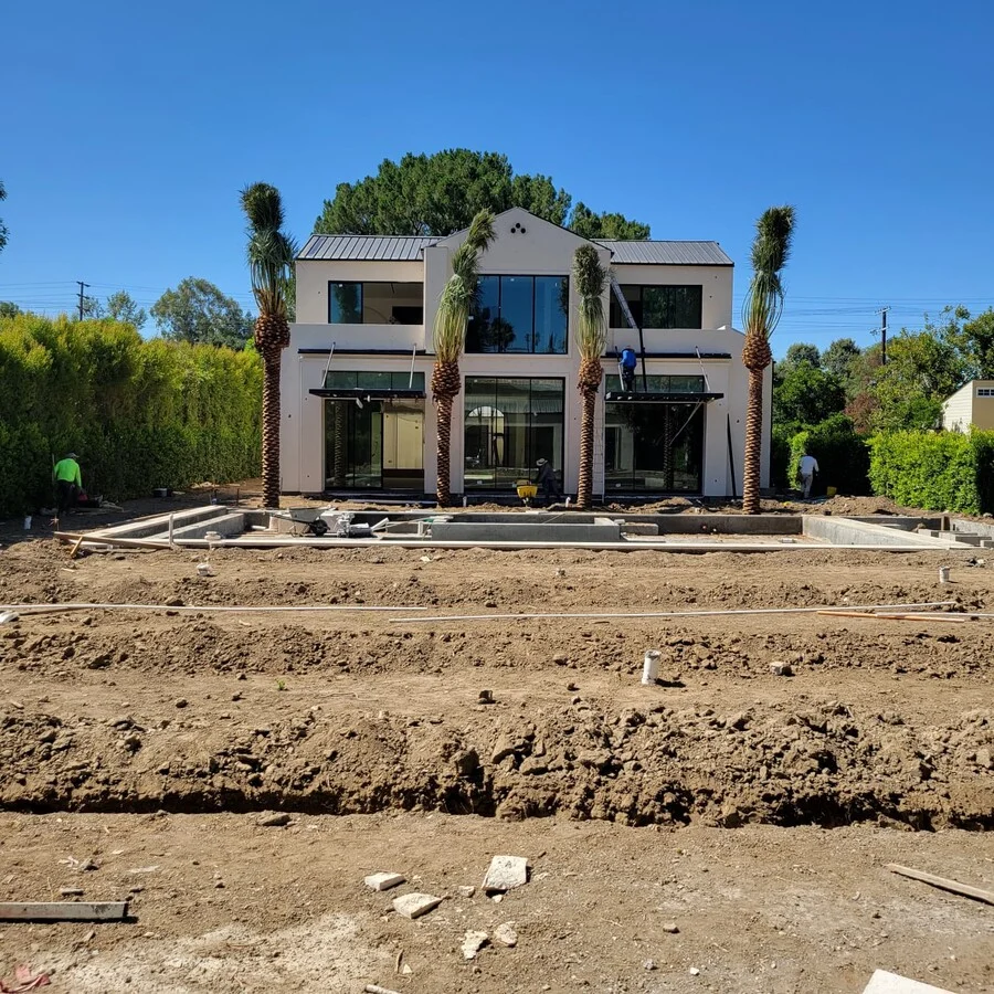 The Estate &mdash; The finished exterior, palm trees and all.