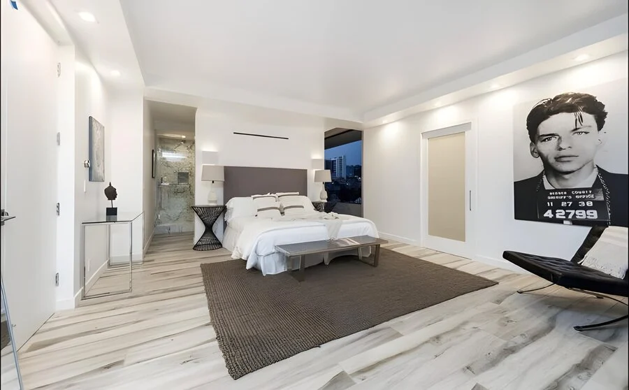 Bedroom, Gallery Wall &mdash; A framed print anchors the primary suite.
